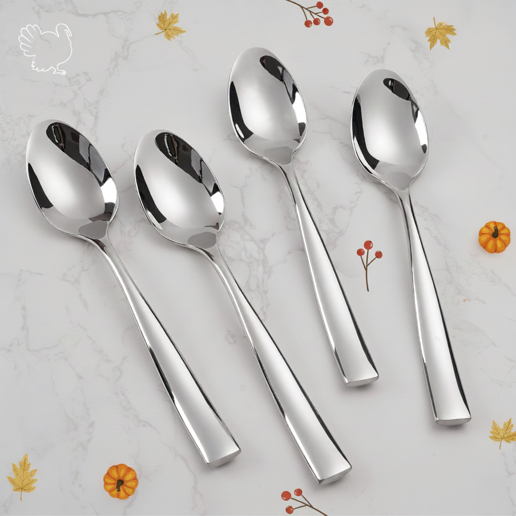 Four shiny stainless steel spoons on marble, surrounded by Thanksgiving icons: turkey, pumpkins, and fall leaves.